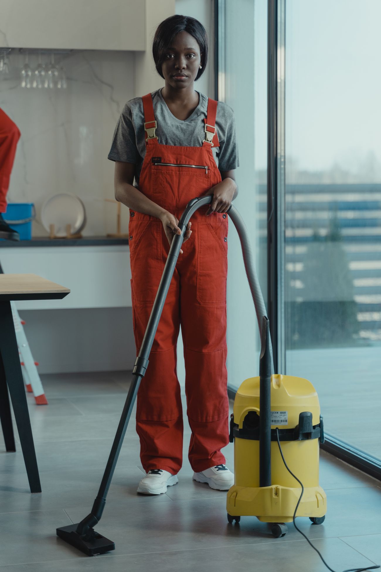 A KAN'I SaniTize professional preparing a clean, bright space
