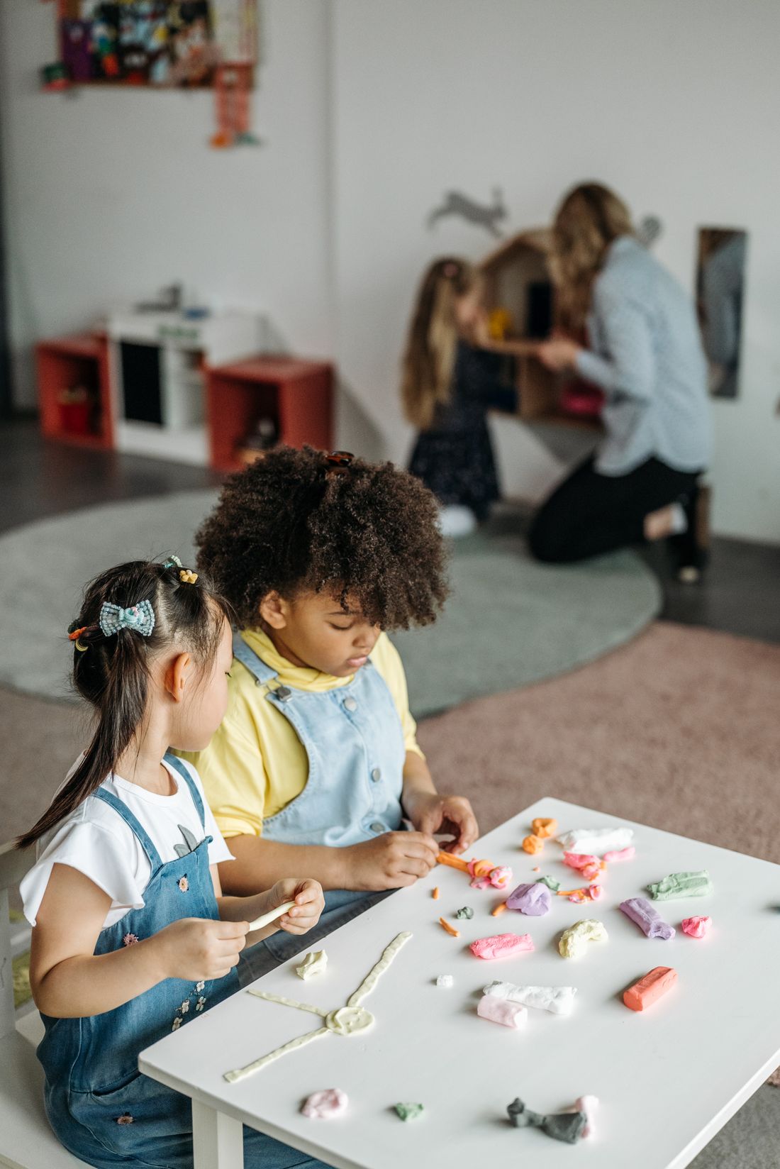 A child in a clean, bright childcare classroom