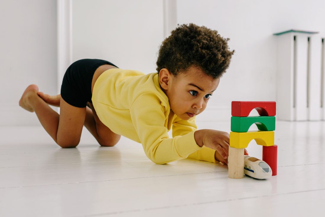 A child playing in a clean indoor activity area